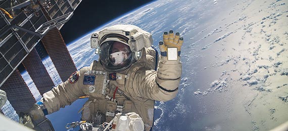 Astronaut in space with Earth as backdrop